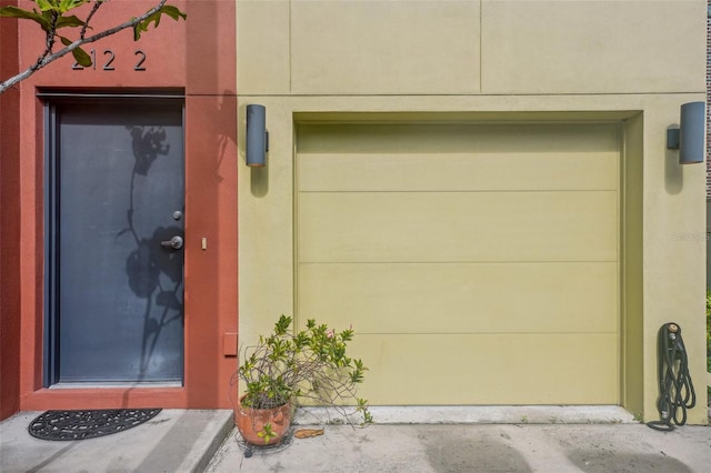 view of exterior entry with a garage