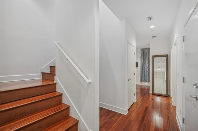 stairway featuring hardwood / wood-style floors