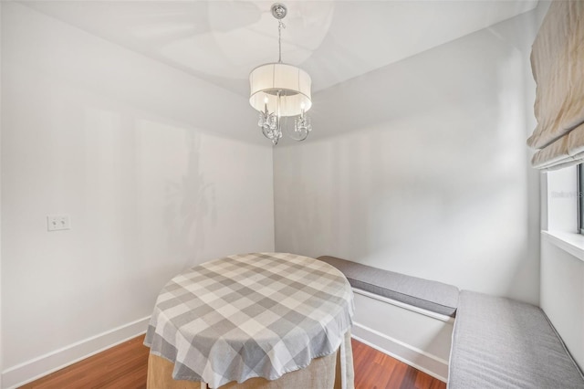 dining room featuring an inviting chandelier and hardwood / wood-style floors