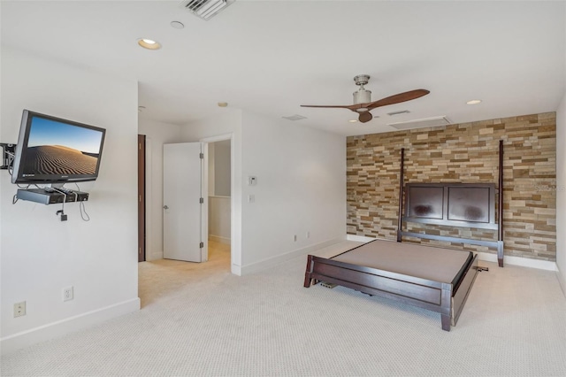 unfurnished living room featuring light colored carpet and ceiling fan