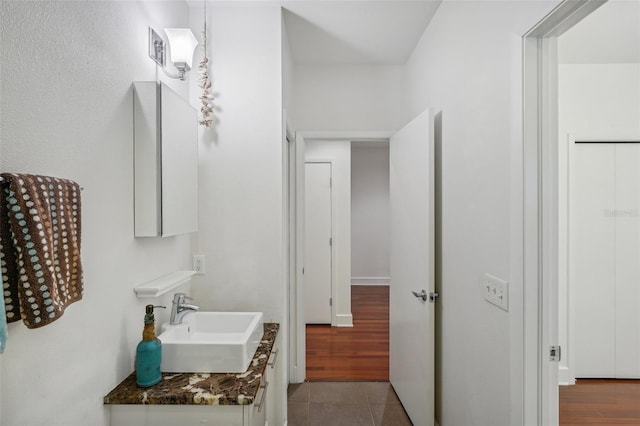 bathroom featuring vanity and tile patterned flooring