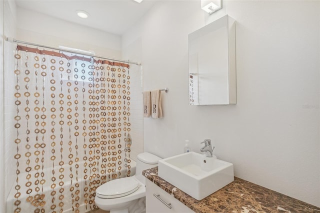 full bathroom featuring vanity, toilet, and shower / tub combo