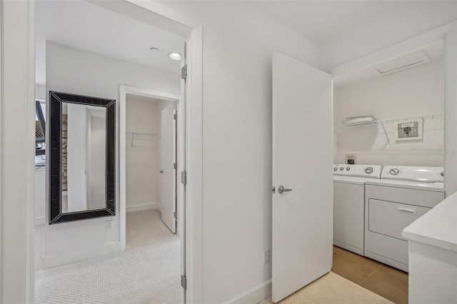 washroom featuring light colored carpet and washer and dryer