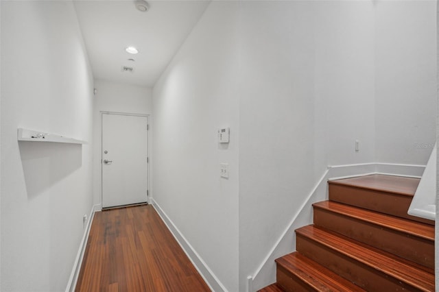 corridor featuring wood-type flooring