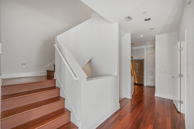 staircase featuring hardwood / wood-style floors