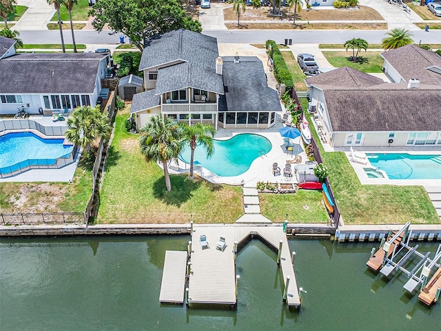 birds eye view of property with a water view