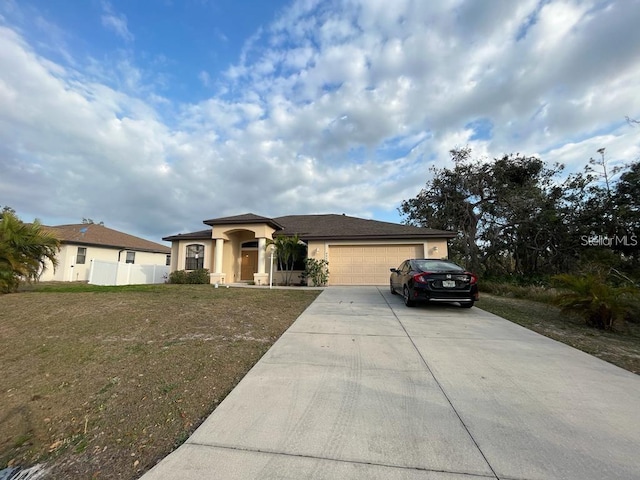 view of front of house with a garage and a front lawn