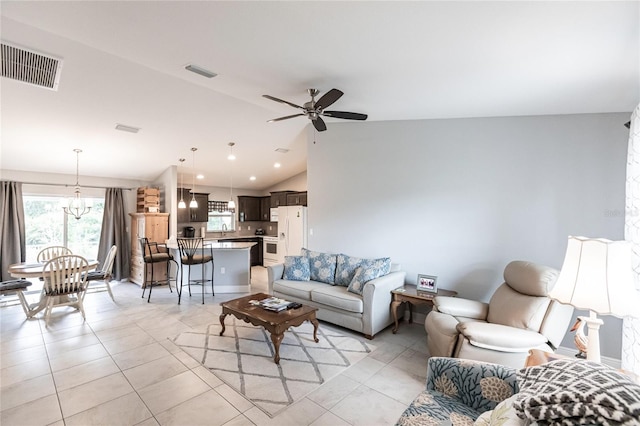 living room featuring ceiling fan, light tile patterned floors, sink, and vaulted ceiling