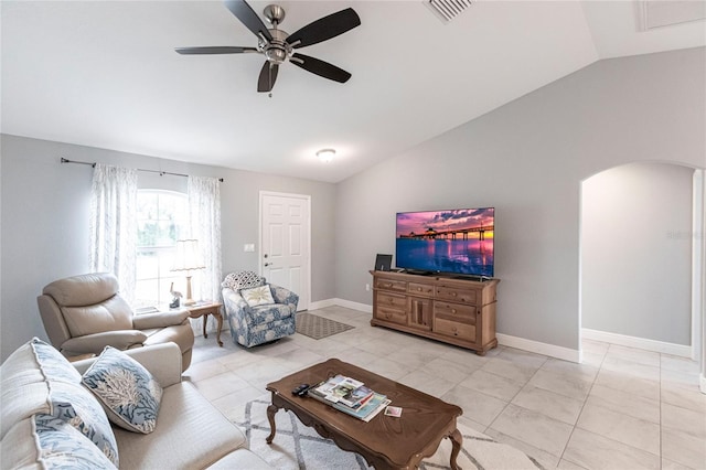 tiled living room featuring ceiling fan and vaulted ceiling