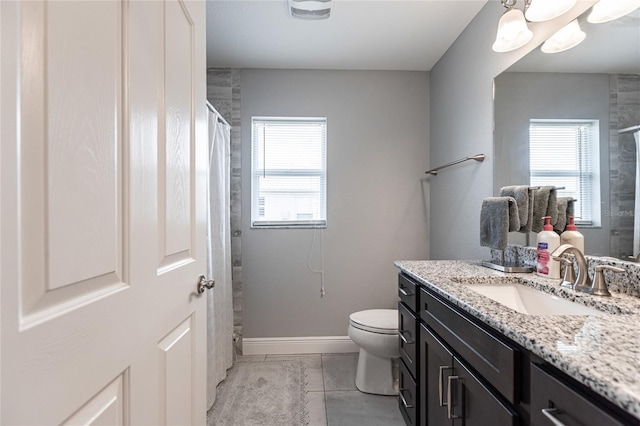 bathroom with a shower with shower curtain, vanity, toilet, and a healthy amount of sunlight