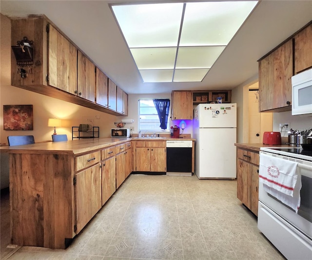 kitchen with sink and white appliances