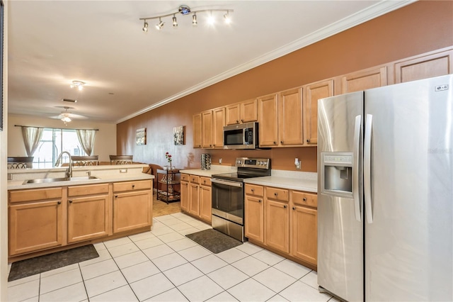 kitchen with stainless steel appliances, light countertops, ornamental molding, light tile patterned flooring, and a sink