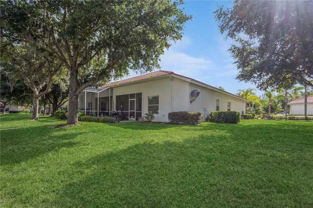 exterior space featuring stucco siding and a yard