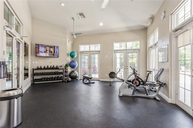 gym with french doors, a healthy amount of sunlight, and baseboards