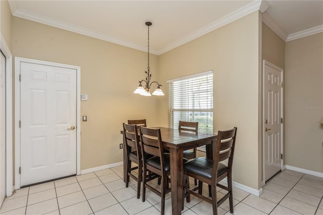 dining space with light tile patterned floors, crown molding, baseboards, and a notable chandelier