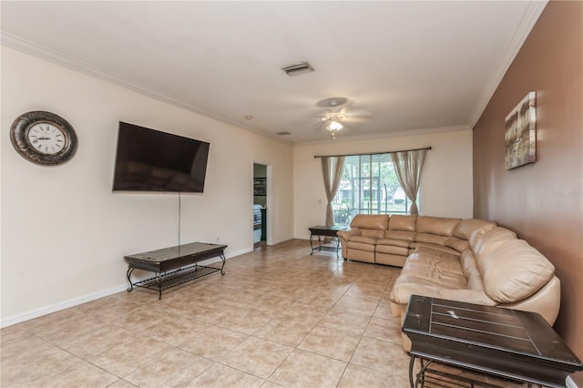 living area featuring light tile patterned floors, visible vents, baseboards, ceiling fan, and crown molding