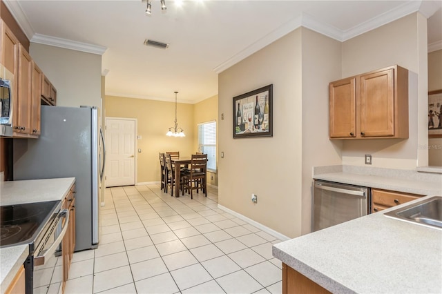 kitchen featuring light tile patterned floors, visible vents, decorative light fixtures, stainless steel appliances, and light countertops