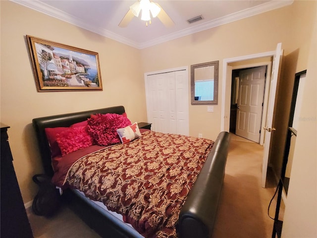 bedroom featuring a closet, visible vents, ornamental molding, carpet flooring, and ceiling fan