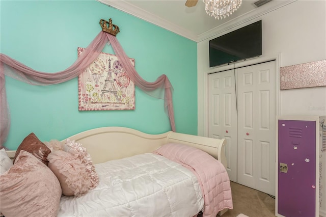 bedroom with carpet, a closet, and crown molding