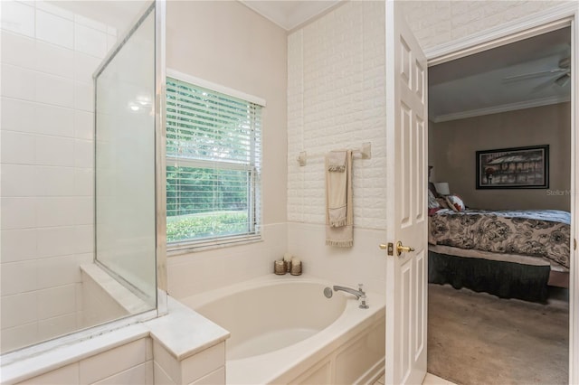 ensuite bathroom featuring ensuite bathroom, ceiling fan, ornamental molding, and a bath