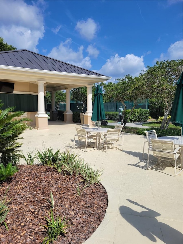 view of patio / terrace featuring fence and a gazebo