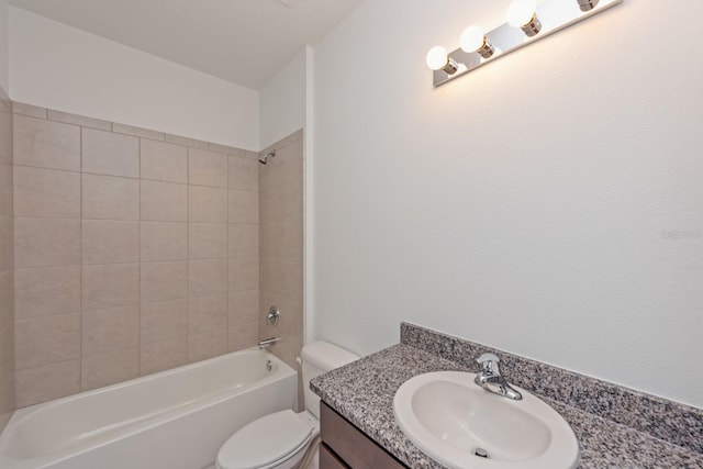 full bathroom featuring vanity, toilet, and tiled shower / bath combo