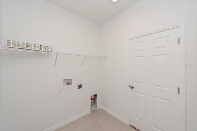 washroom featuring light tile patterned flooring, washer hookup, and hookup for an electric dryer