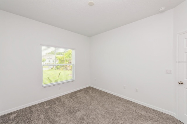 empty room with carpet flooring