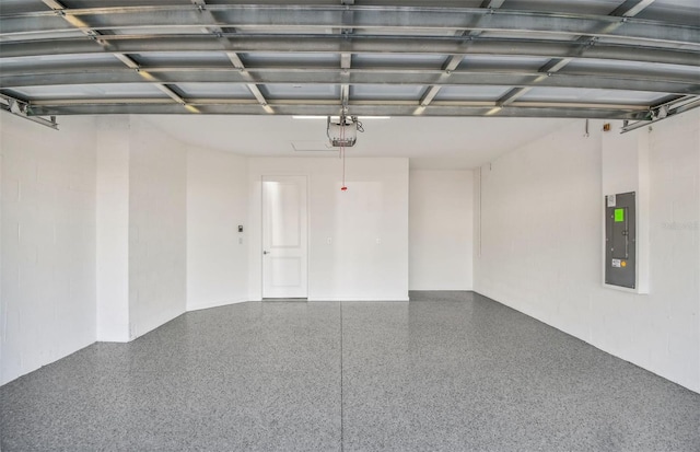 garage featuring a garage door opener and electric panel