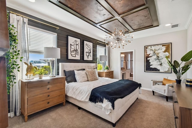 carpeted bedroom with ornamental molding, ensuite bathroom, and a notable chandelier