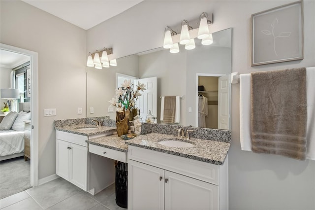 bathroom with tile patterned flooring and vanity