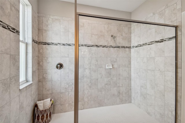 bathroom with tiled shower