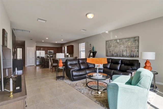 living room featuring light tile patterned floors