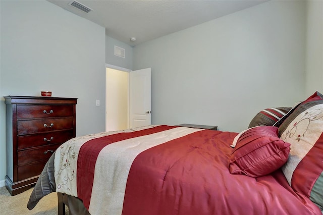 bedroom with light colored carpet