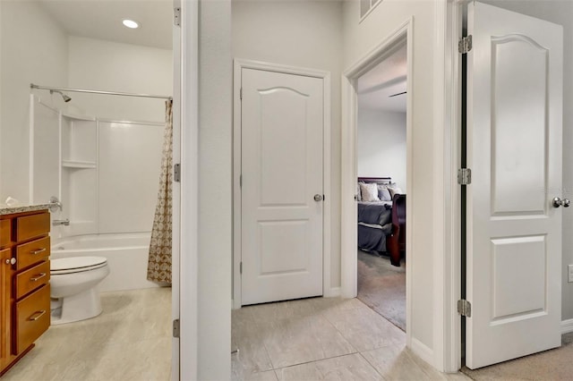 bathroom featuring tile patterned flooring, shower / tub combo, and toilet