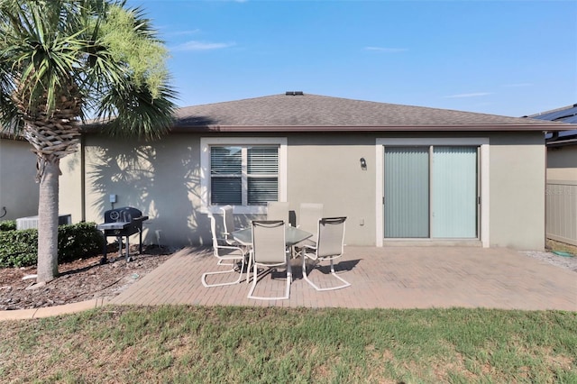 rear view of property featuring a patio