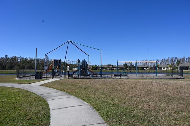 community play area with a lawn