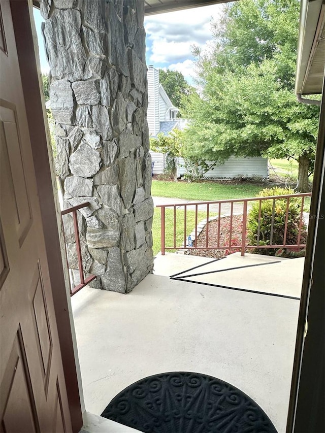 doorway to outside featuring concrete floors