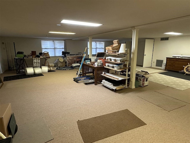 interior space featuring carpet and visible vents