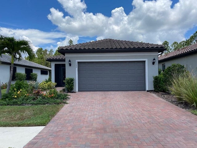 mediterranean / spanish-style home featuring a garage