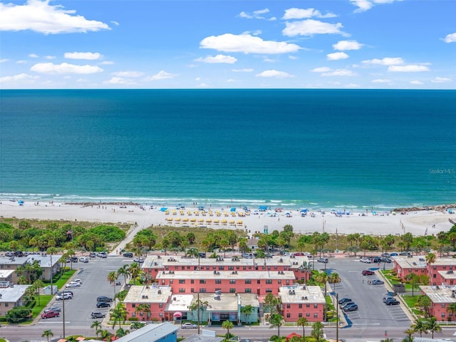 birds eye view of property with a beach view and a water view