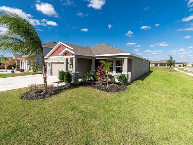 view of front of home featuring a front yard and a garage