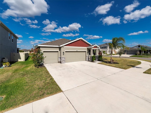 view of front of house featuring a front yard and a garage