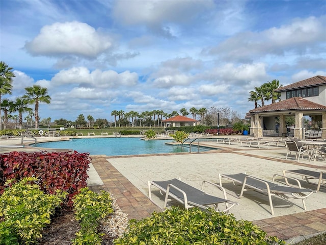 view of swimming pool featuring a patio area