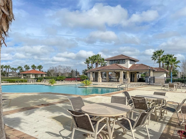 view of swimming pool featuring a patio area