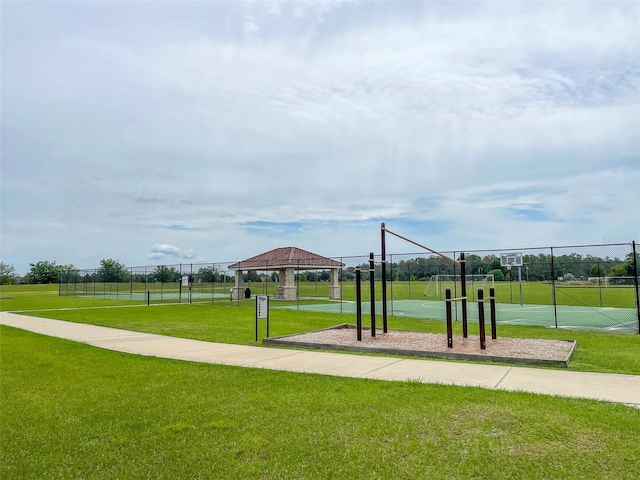 view of property's community with a gazebo and a yard