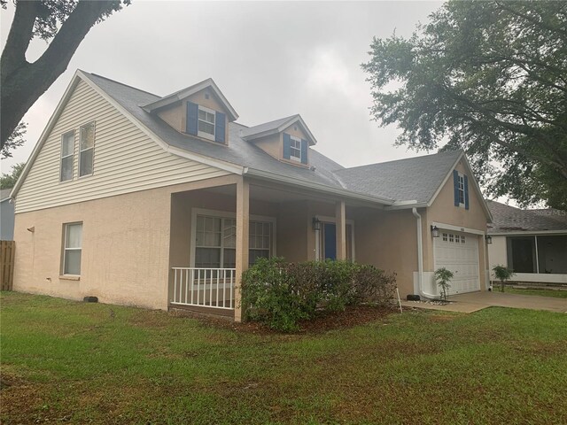 view of front of property with a garage and a front yard