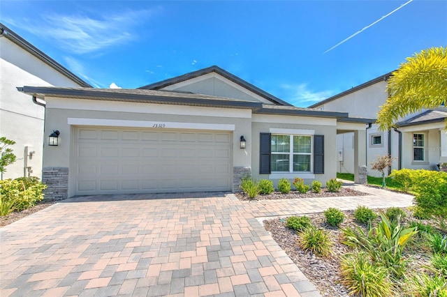 single story home featuring a garage