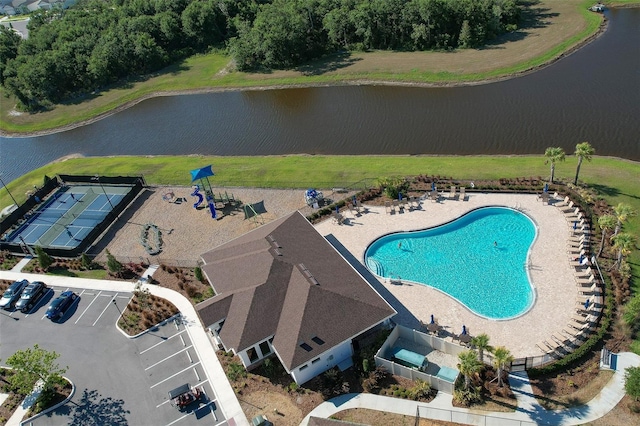 view of pool with a water view