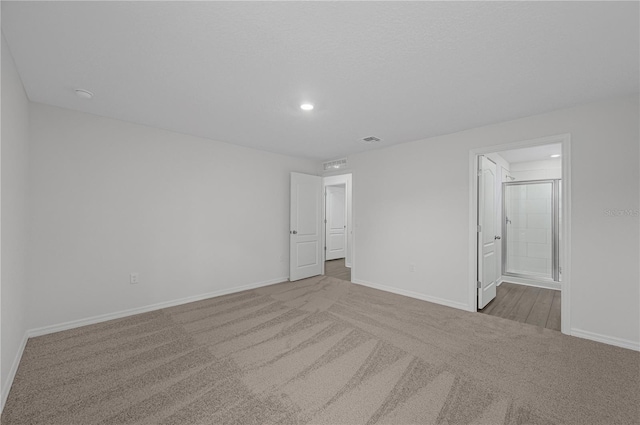 spare room with light colored carpet